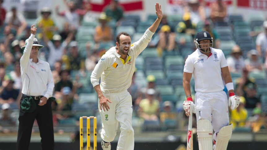 Nathan Lyon celebrates taking a wicket for Australia in the 2-13-14 Ashes series.