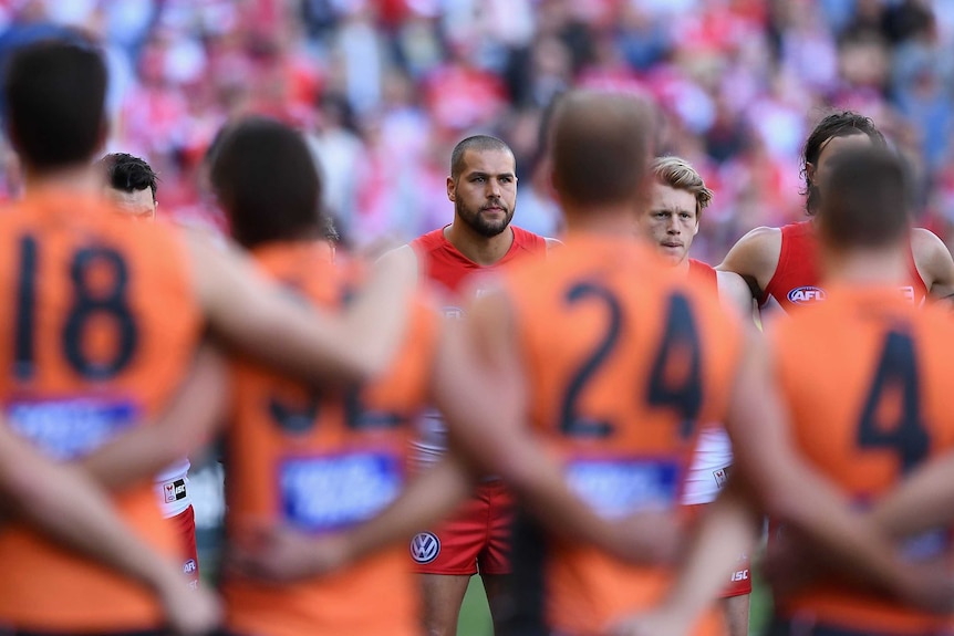 Sydney's Lance Franklin lines up for the national anthem against GWS