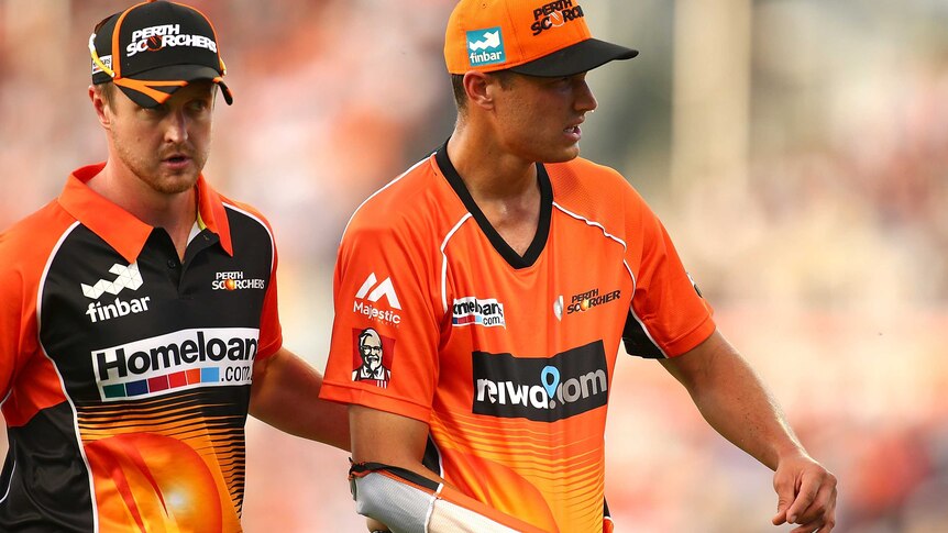 Nathan Coulter-Nile leaves after injuring his shoulder in Scorchers-Strikers Big Bash League match.