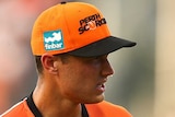 Nathan Coulter-Nile leaves after injuring his shoulder in Scorchers-Strikers Big Bash League match.
