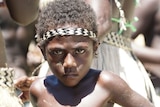 A young boy in Bougainville wears traditional clothes.