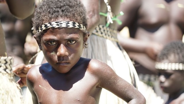 A young boy in Bougainville wears traditional clothes.