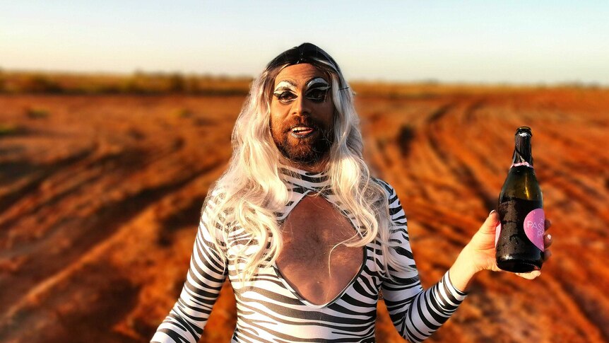 Karratha local Rhys Heland, wearing a zebra-print dress and in drag make-up
