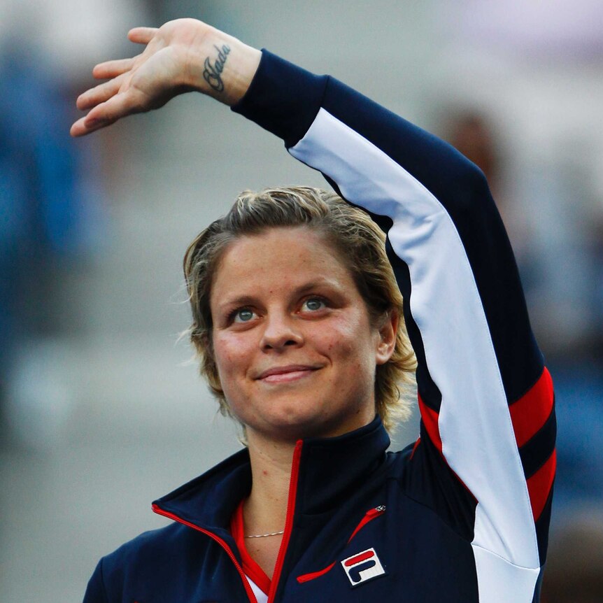Kim Clijsters smiles and waves to the US Open crowd after her last match on tour before retirement.