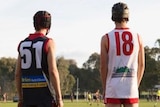 country footy players watch on