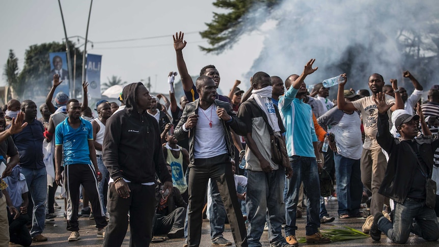 Supporters of Gabonese opposition leader Jean Ping face security forces (unseen) during protests in Libreville.