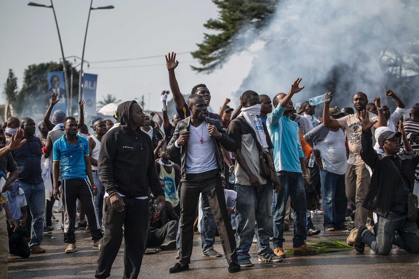Supporters of Gabonese opposition leader Jean Ping face security forces (unseen) during protests in Libreville.
