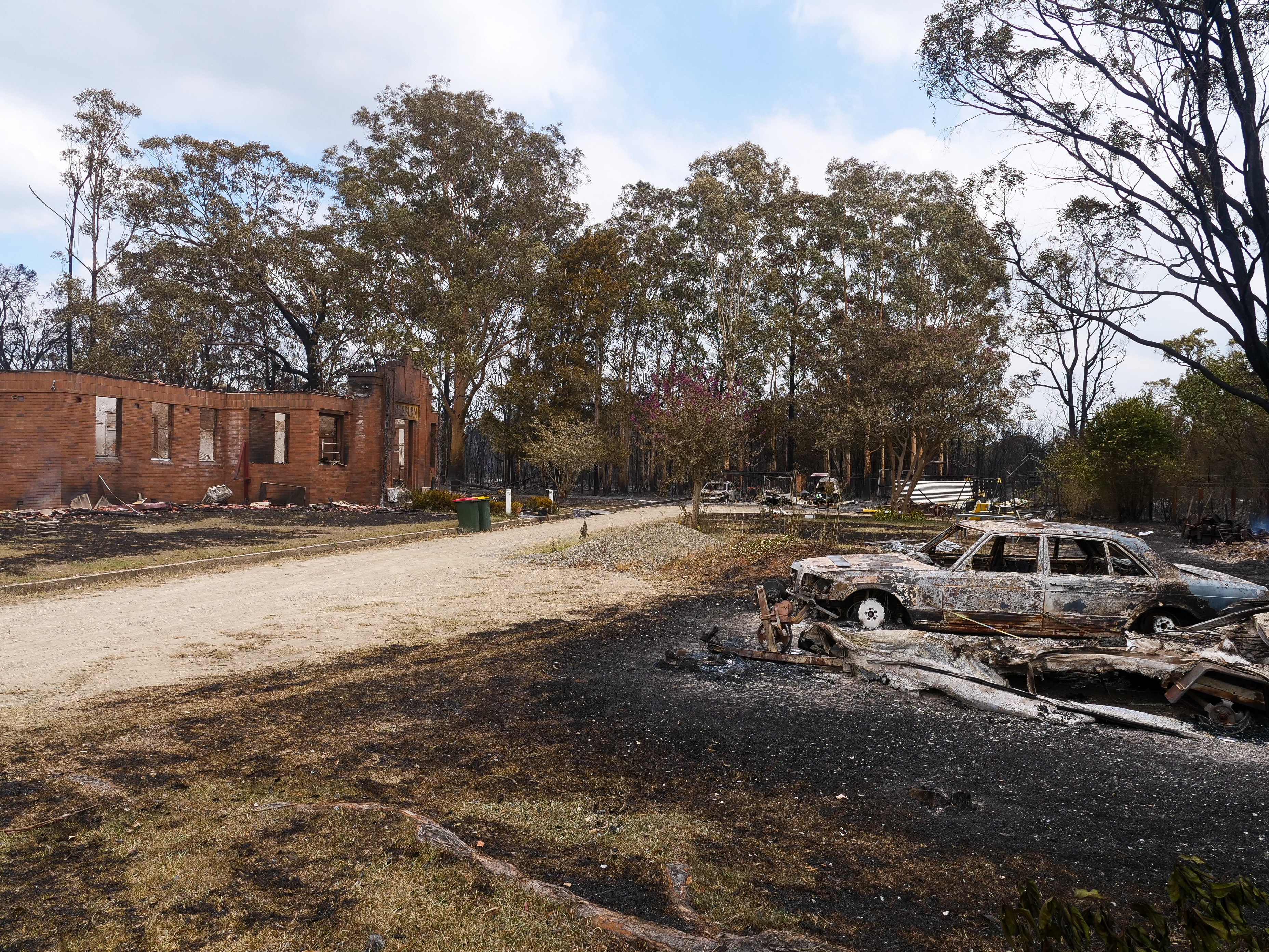 The burnt exterior of a brick home