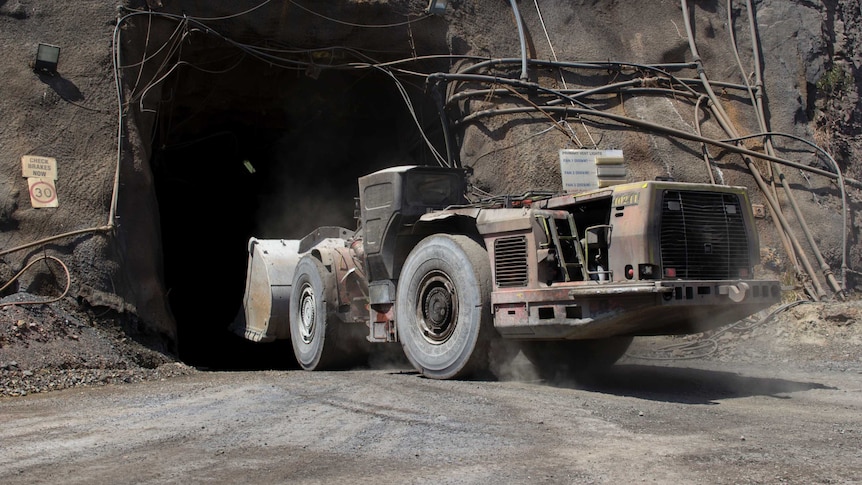 a mining truck entering a tunnel.