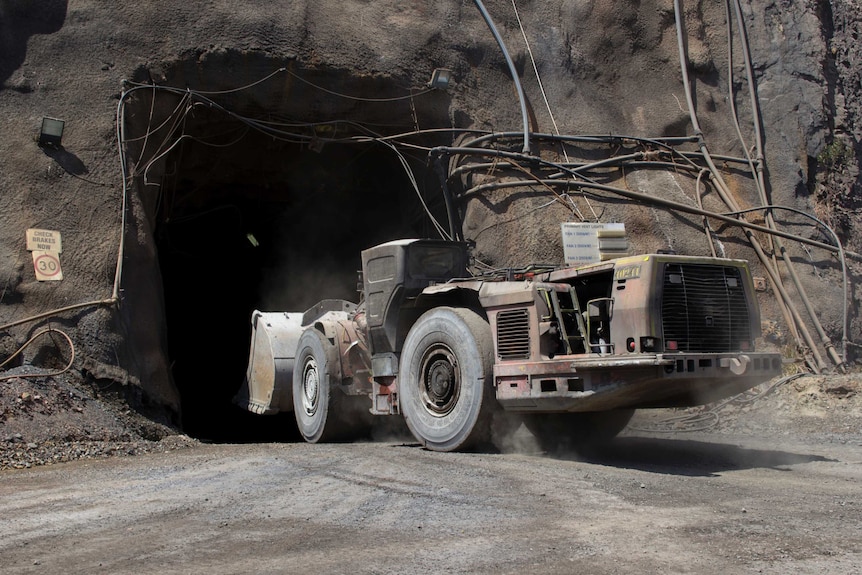 a mining truck entering a tunnel.