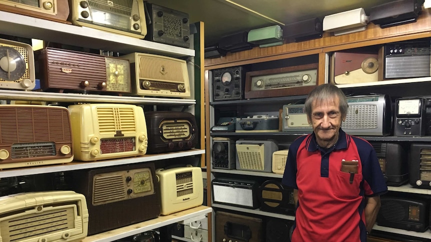 John Scott with his collection of wirelesses in his Maffra home, in eastern Victoria.