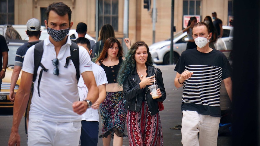A street scene of Sydney residents wearing masks.