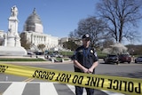 Police guard the US Capitol building after shooting incident