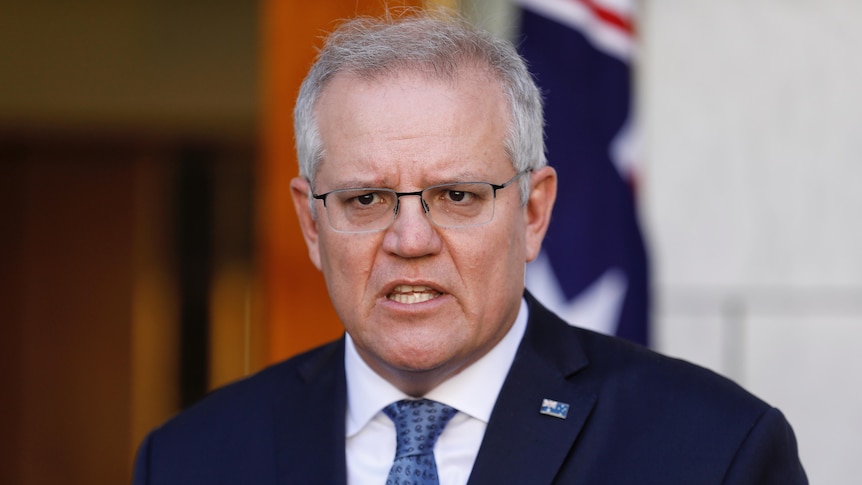 Prime Minister Scott Morrison in courtyard blue tie