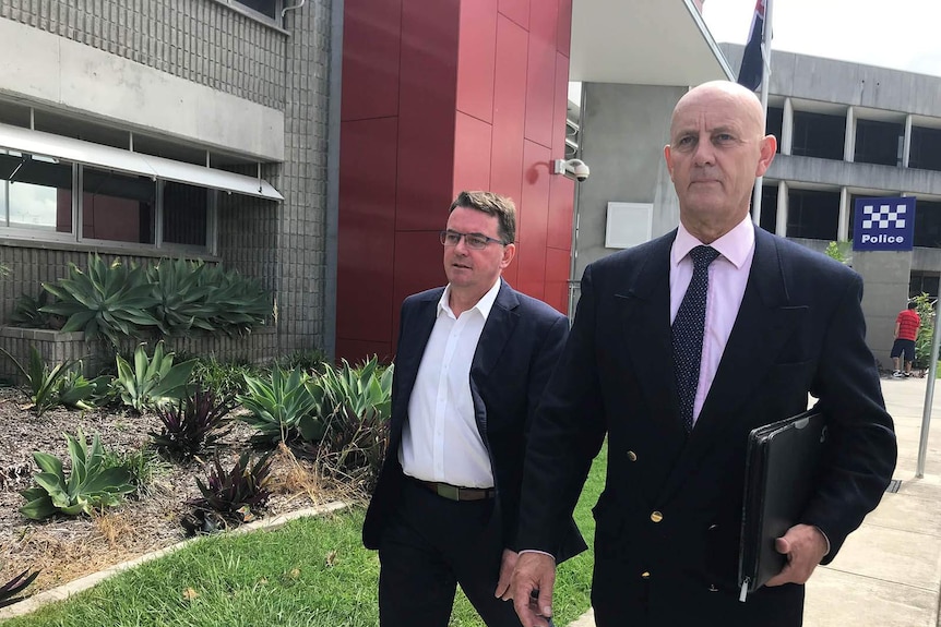 Logan Mayor Luke Smith and another man outside Logan police watch house