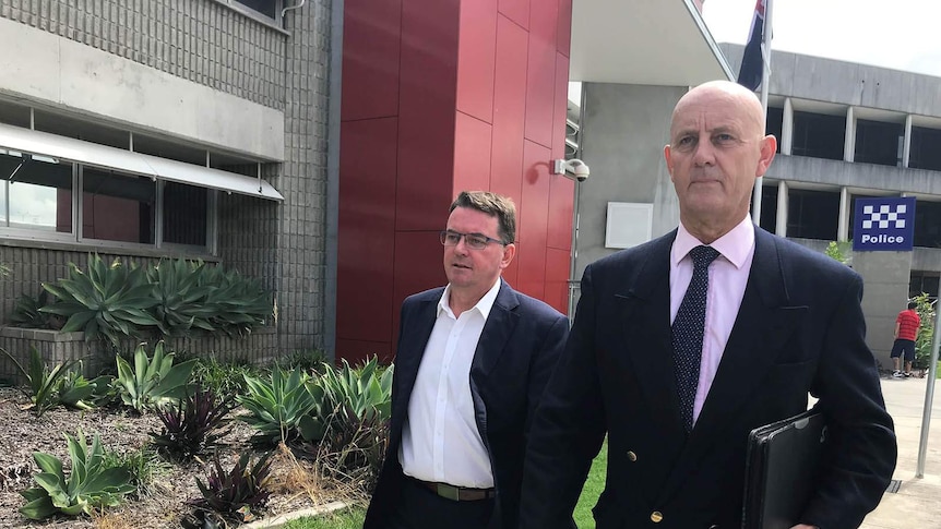 Logan Mayor Luke Smith and another man outside Logan police watch house