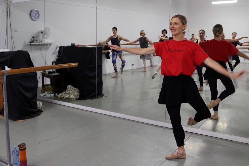 Teacher Natalie Hammond takes a morning ballet class through barre work.