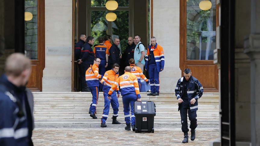 Emergency services rush into building to treat people after lightning strikes