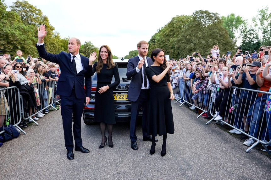 William, Kate, Harry and Meghan wave at crowds.