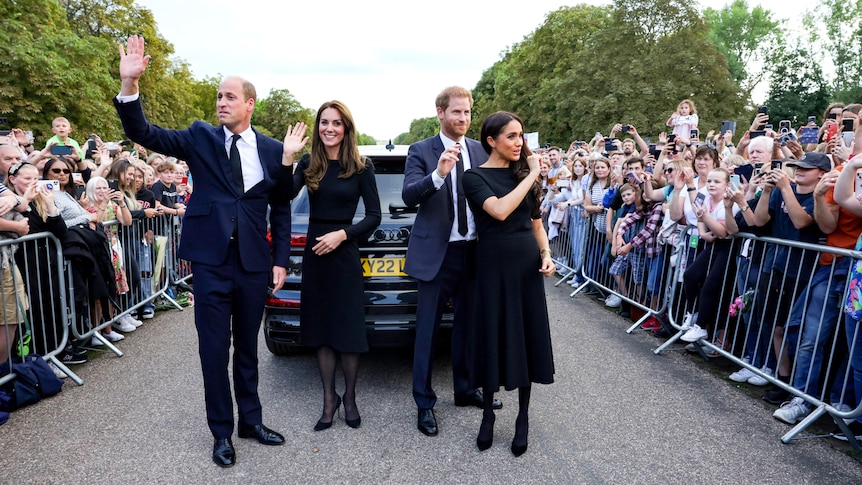 William, Kate, Harry and Meghan wave at crowds.
