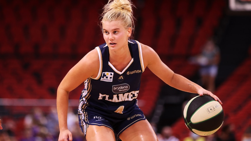 Shyla Heal dribbling the ball during a WNBL match