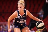 Shyla Heal dribbling the ball during a WNBL match