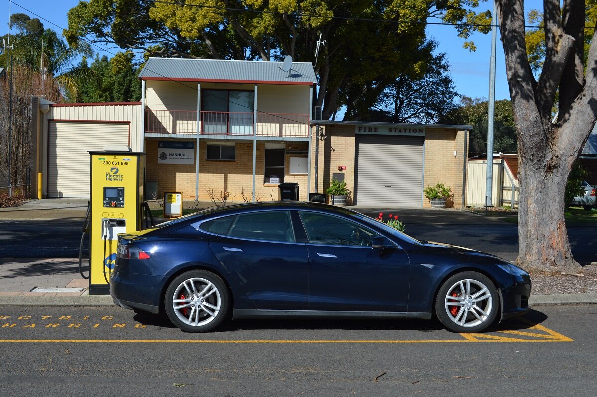 An electric car plugging into a charger outside a home in Nannup.