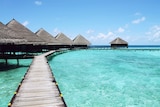 Wooden bungalows on blue ocean