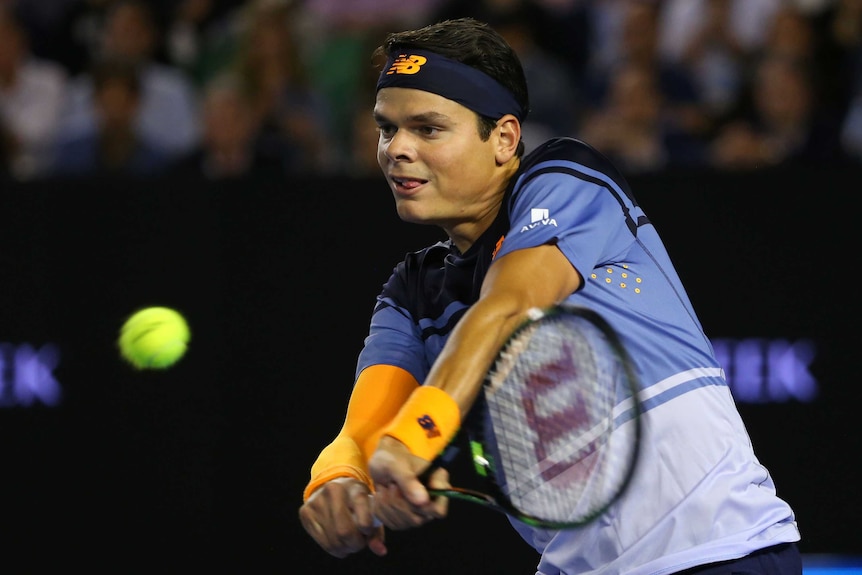 Packing a punch ... Milos Raonic plays a backhand return against Andy Murray in their semi-final