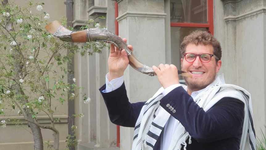 Rabbi Gabi Kaltmann from Ark Centre in Melbourne sounding the shofar (ram’s horn)