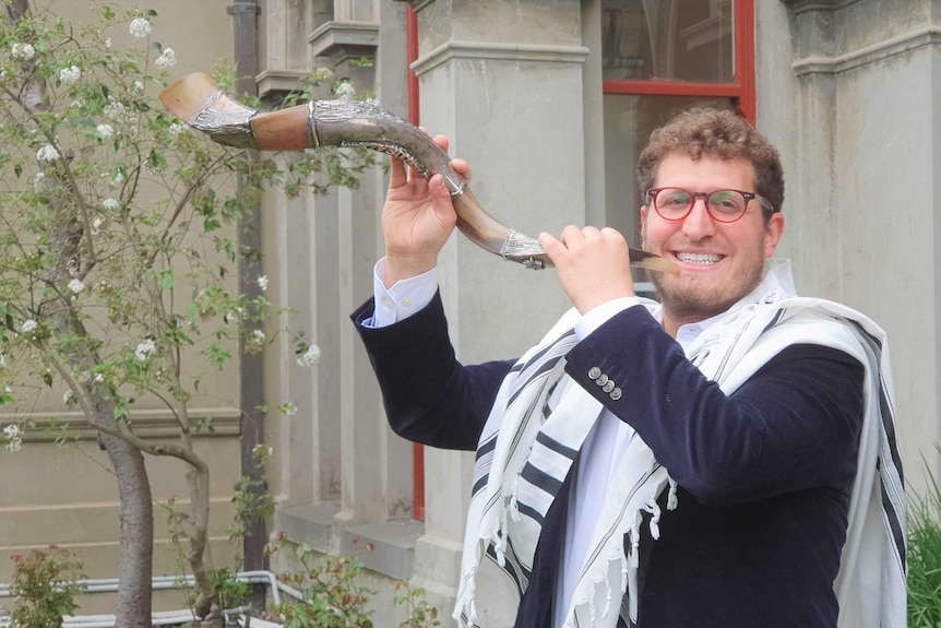 For Rosh Hashanah, Rabbi Gabi Kaltmann played the shofar (ram's horn) on community members' lawns, as synagogues were closed.