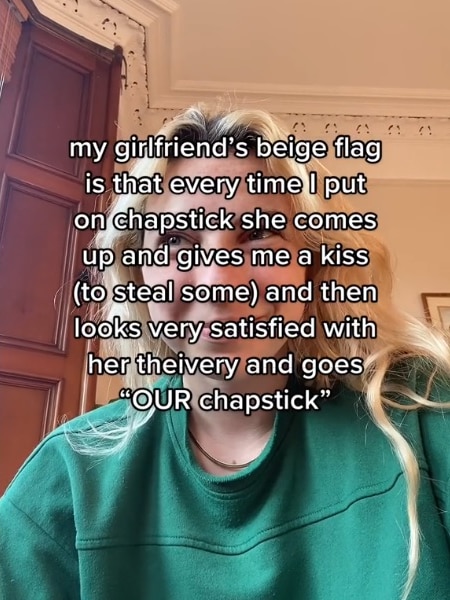 Text says: My girlfriend's beige flag is that every time I put on chapstick she comes up and gives me a kiss (to steal some)