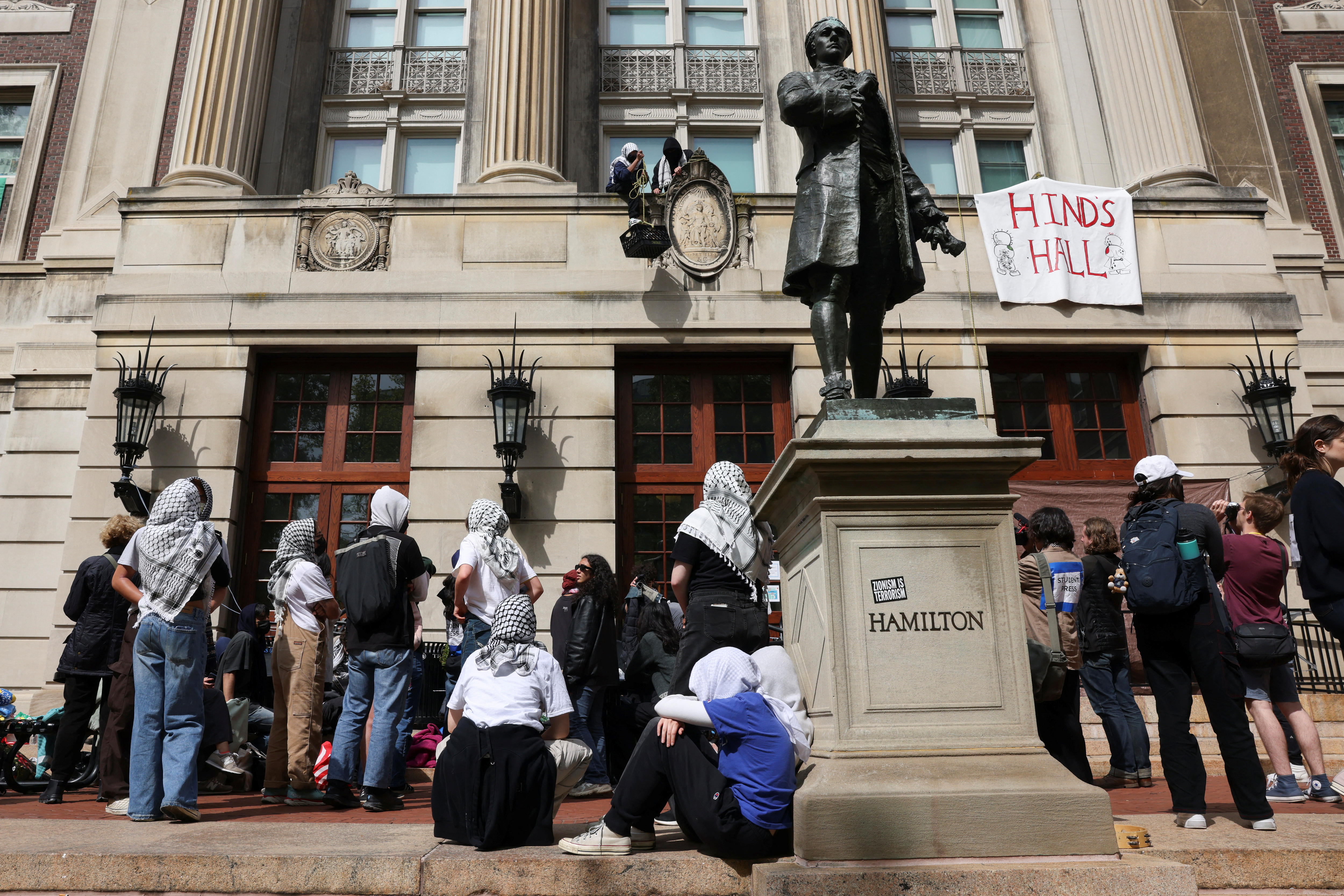 Group of students protest outside Hamilton statue at Colombia University, New York