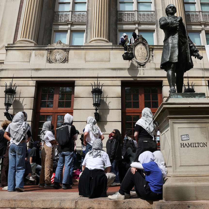 Group of students protest outside Hamilton statue at Colombia University, New York