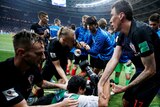 Croatia players help up stricken photographer