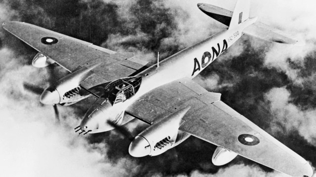 A black and white image of a military plane with two propellers.
