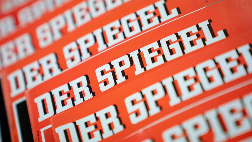 A close-up on a stack of magazines showing the logo of Der Spiegel