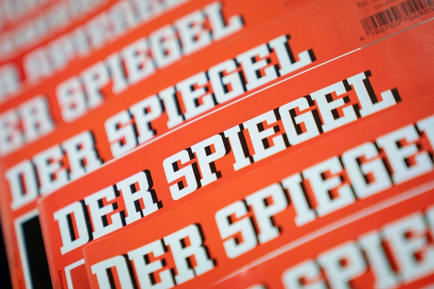 A close-up on a stack of magazines showing the logo of Der Spiegel