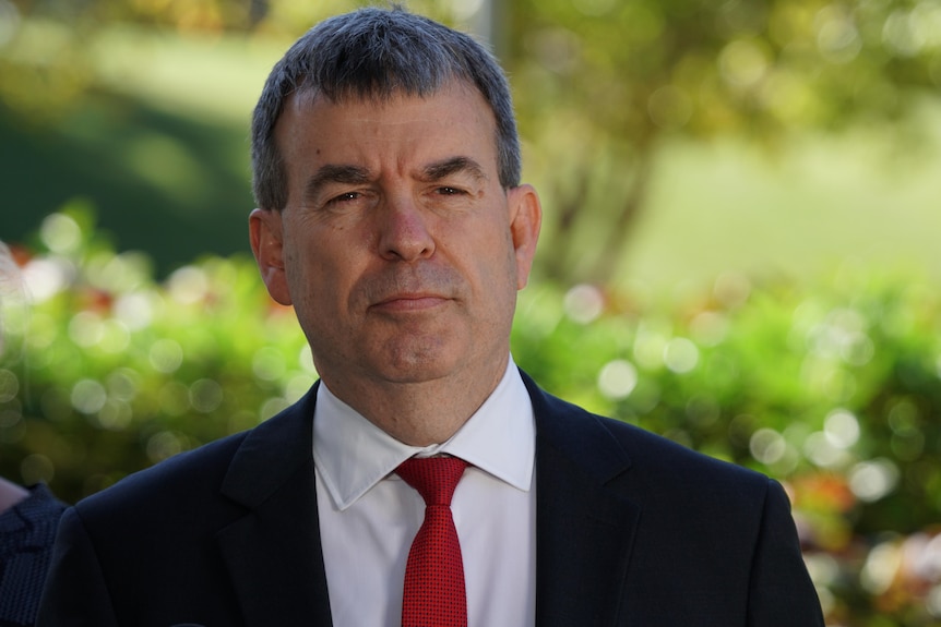 Profile of a man in a suit.