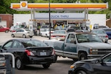 Vehicles are seen queuing at a Shell petrol station 
