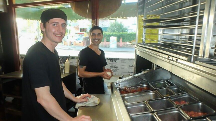 Two pizza chefs in the kitchen at Kookaburra Cafe.