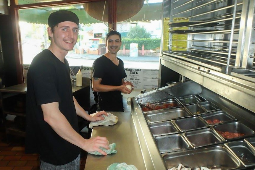 Two pizza chefs in the kitchen at Kookaburra Cafe.