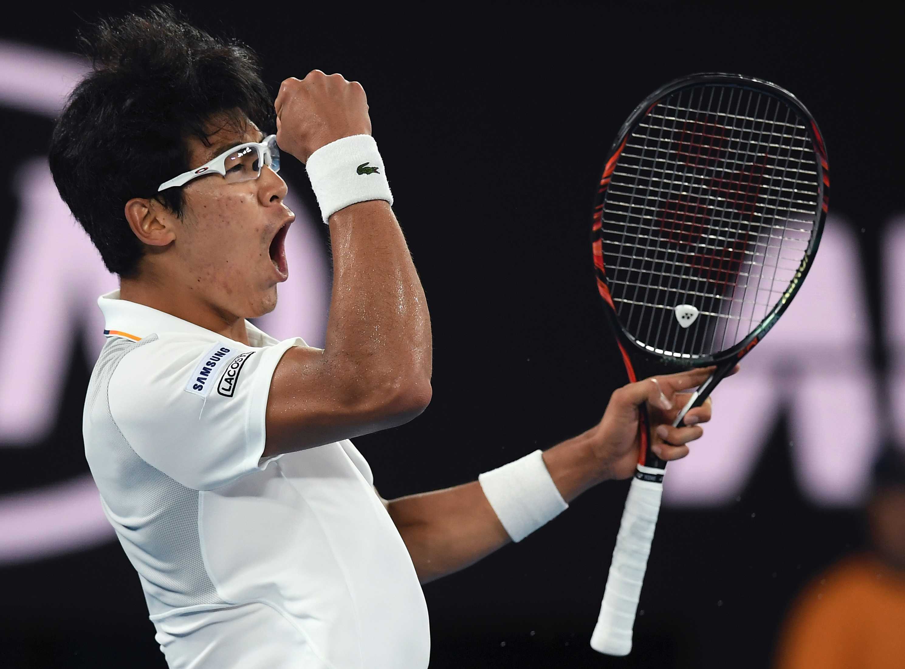 South Korea's Chung Hyeon pumps his fist after winning a point against Novak Djokovic at the Australian Open.