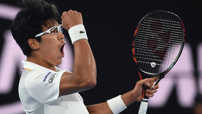 South Korea's Chung Hyeon pumps his fist after winning a point against Novak Djokovic at the Australian Open.