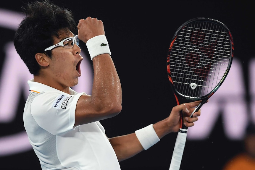 South Korea's Chung Hyeon pumps his fist after winning a point against Novak Djokovic at the Australian Open.