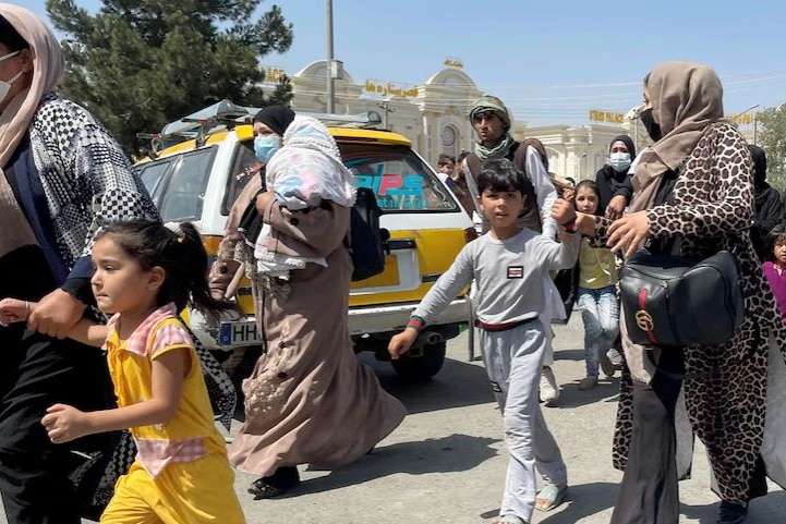 Women and children run from the Taliban in Kabul.