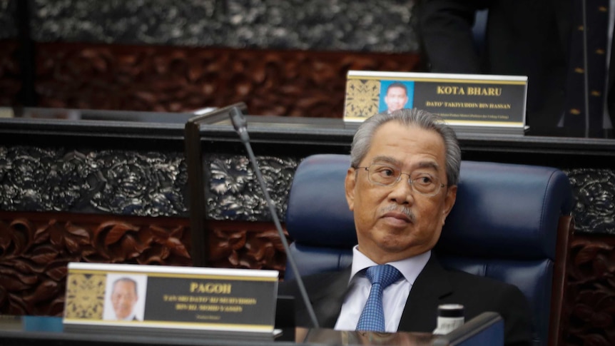 Prime Minister Muhyiddin Yassin sits in parliament.