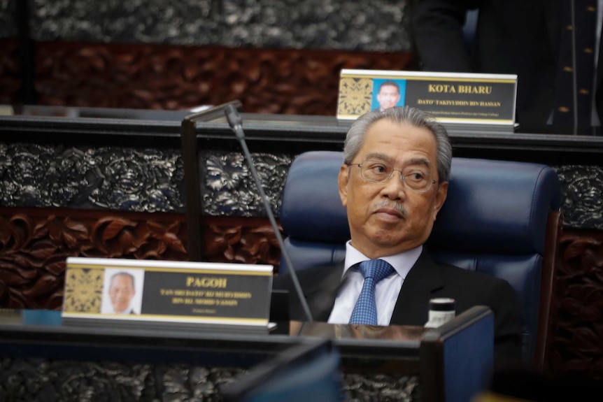 Prime Minister Muhyiddin Yassin sits in parliament.