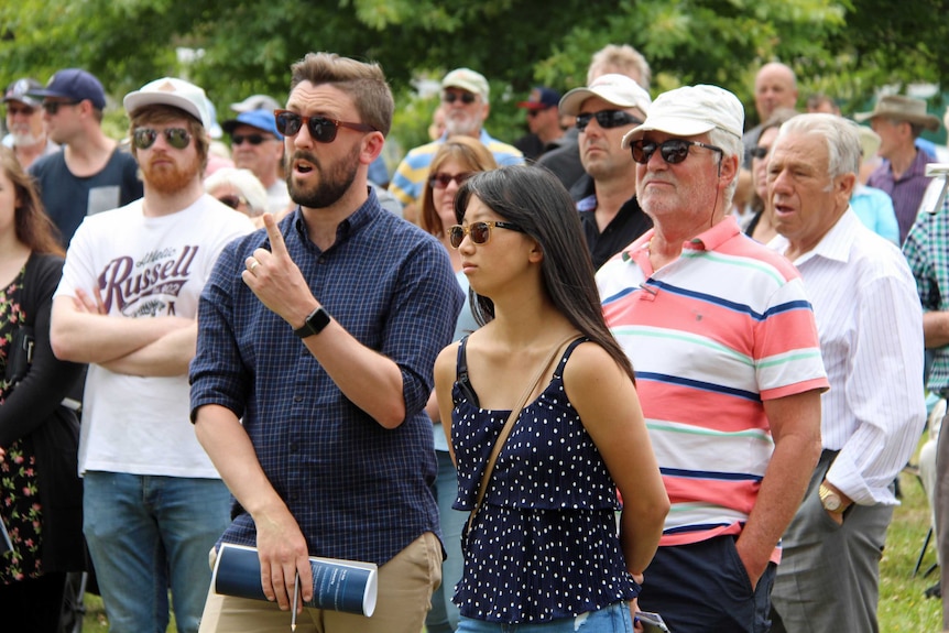 A young couple make a bid on land in Hobart