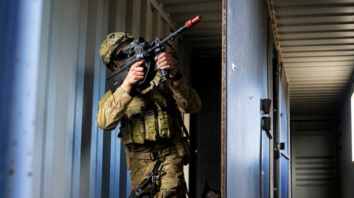 Australian Army soldier, Private Josh Wilkinson with Shine, his military police dog, during Exercise Hamel 2018.